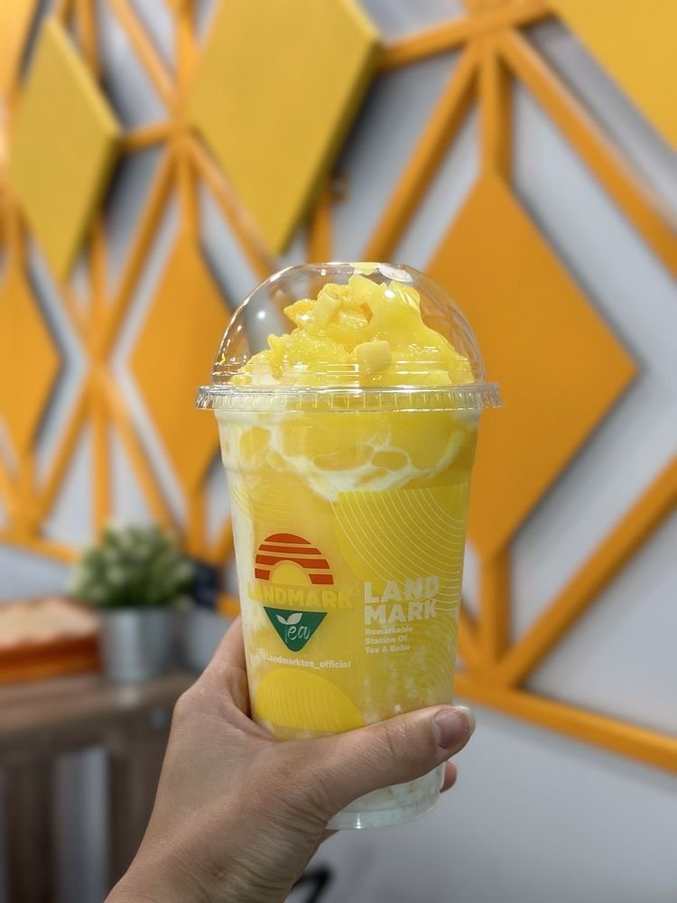 A Mango Sticky Rice Slushy held in hand