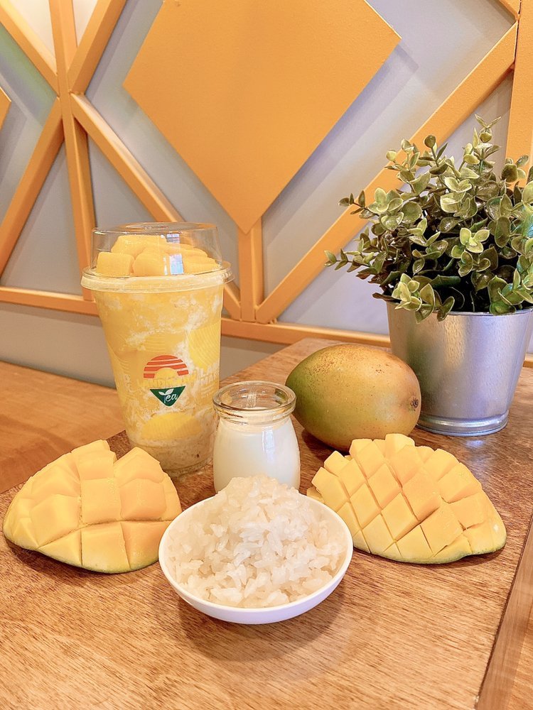 Mango Sticky Rice Slushy styled with slices of fresh mango and a scoop of sticky rice