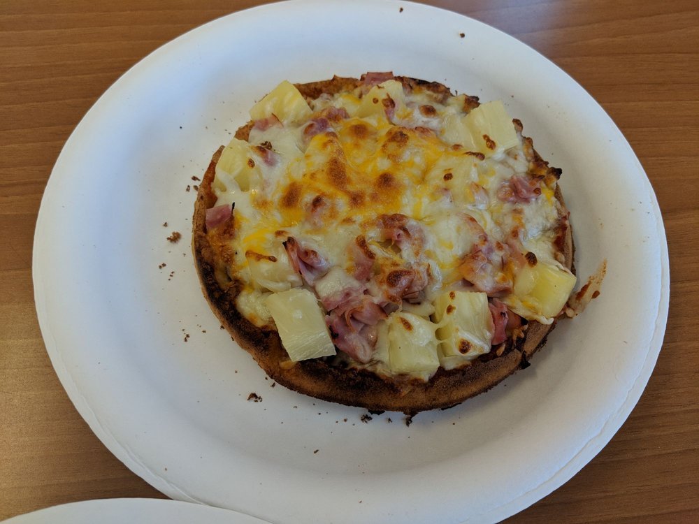 Hawaiian waffle pizza with smoked ham, pineapple and melted cheese on a waffle crust