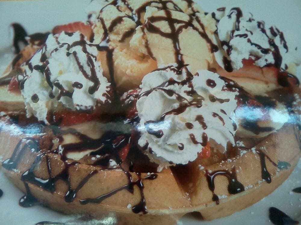 Shortcake Split waffle with strawberries, banana, whipped cream and a chocolate drizzle
