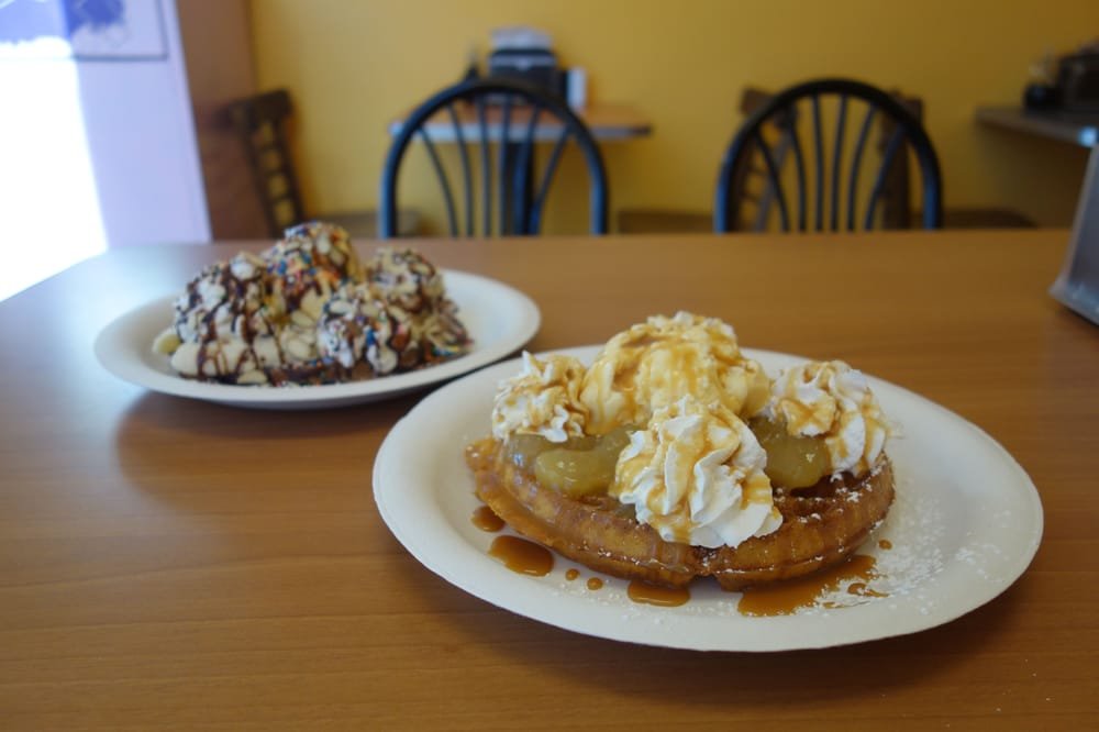 The Sweet P pumpkin waffle with apple pie filling, caramel and vanilla ice cream, a chocolate waffle behind it
